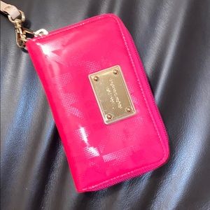 Michael Kors wristlet with a few stains